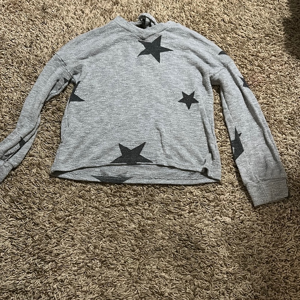 Grey sweater with black stars. Light weight.